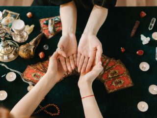 Photo by Mikhail Nilov on <a href="https://www.pexels.com/photo/a-fortune-telling-session-in-progress-6944915/" rel="nofollow">Pexels.com</a>