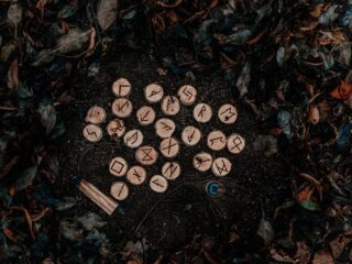 Photo by sam Hancock on <a href="https://www.pexels.com/photo/runic-letters-on-wood-chunks-and-ground-with-autumn-leaves-10110445/" rel="nofollow">Pexels.com</a>