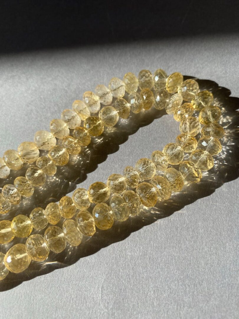 close up photo of two strands of citrine beads