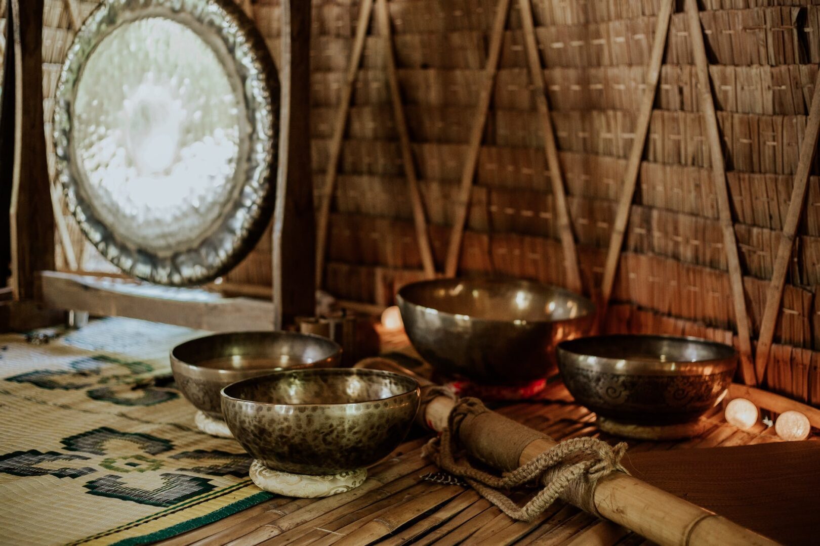 tibetan singing bowls and a bamboo pole